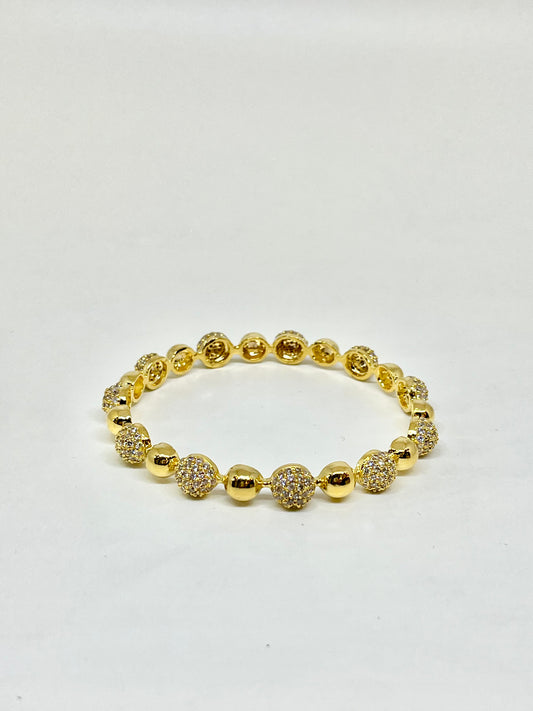 Shimmering Gold Bangles With Crystals