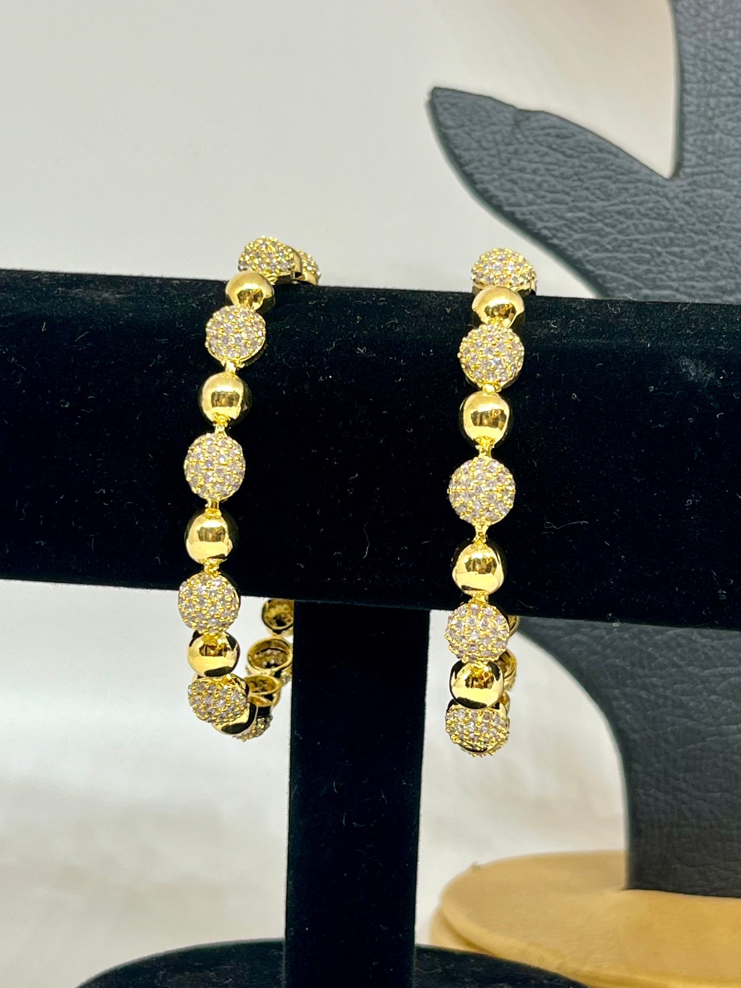 Shimmering Gold Bangles With Crystals
